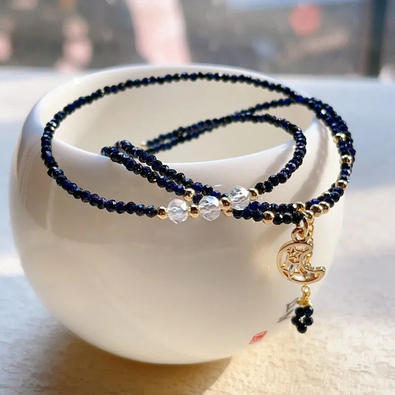 Blue and gold three-ring women's bracelet with sand stone cut beads showing manual processing texture details