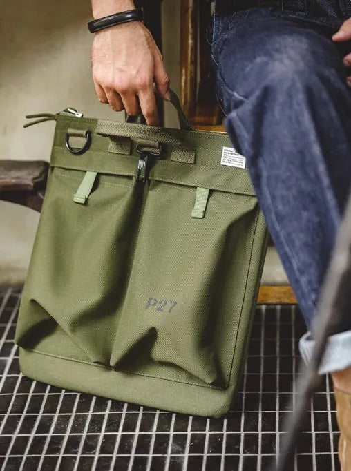 Canvas crossbody messenger bag in military green with 15 inch laptop compartment and shoulder strap