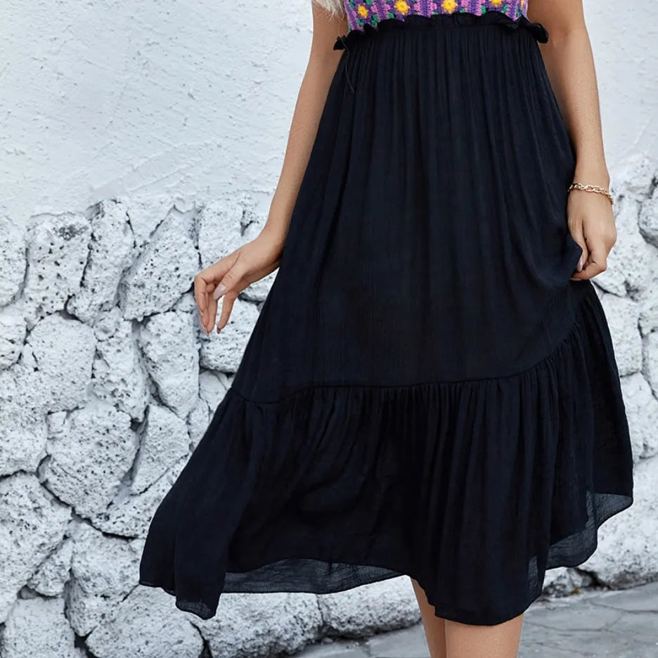 Purple women's sleeveless dress with hand-hooked white floral embroidery, shown with a separate acrylic skirt.