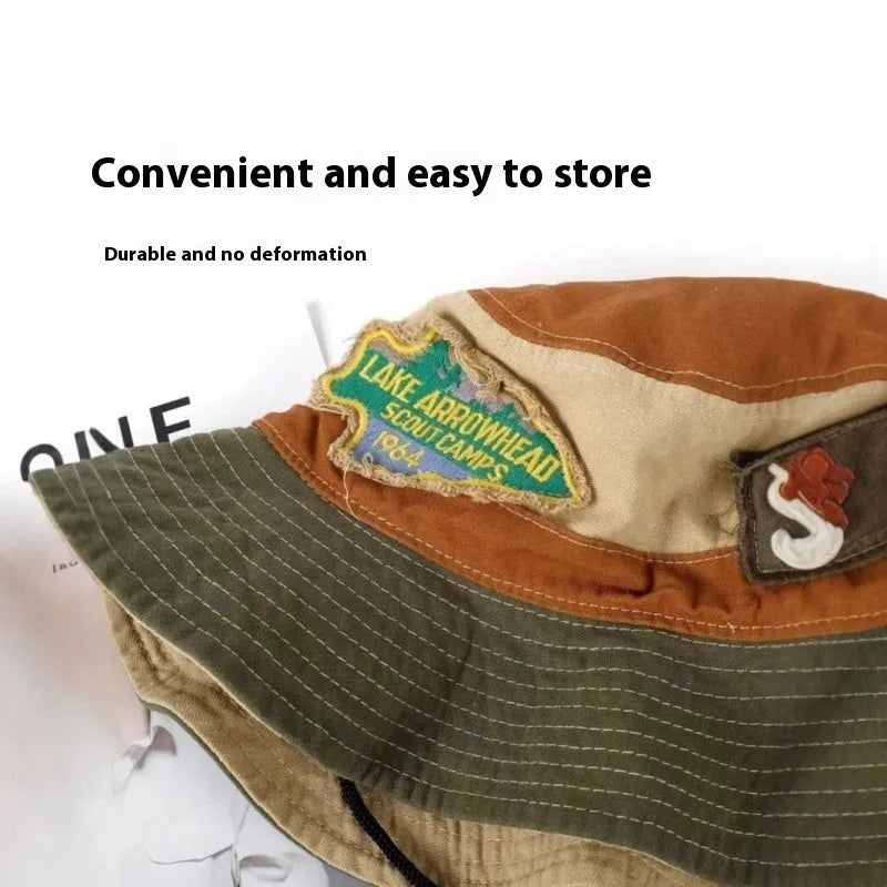 Army green cotton women's fisherman hat with hand-painted patchwork details and a flat top crown.