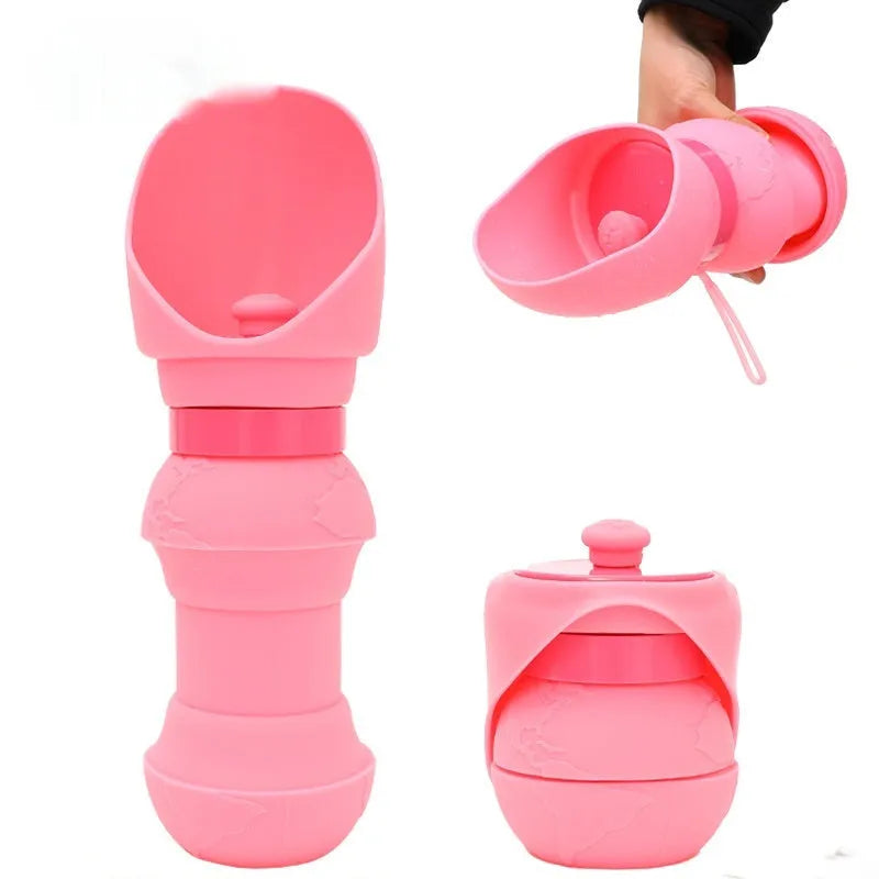 A collapsed flat and an opened pink silicone folding pet water cup on a grey background.