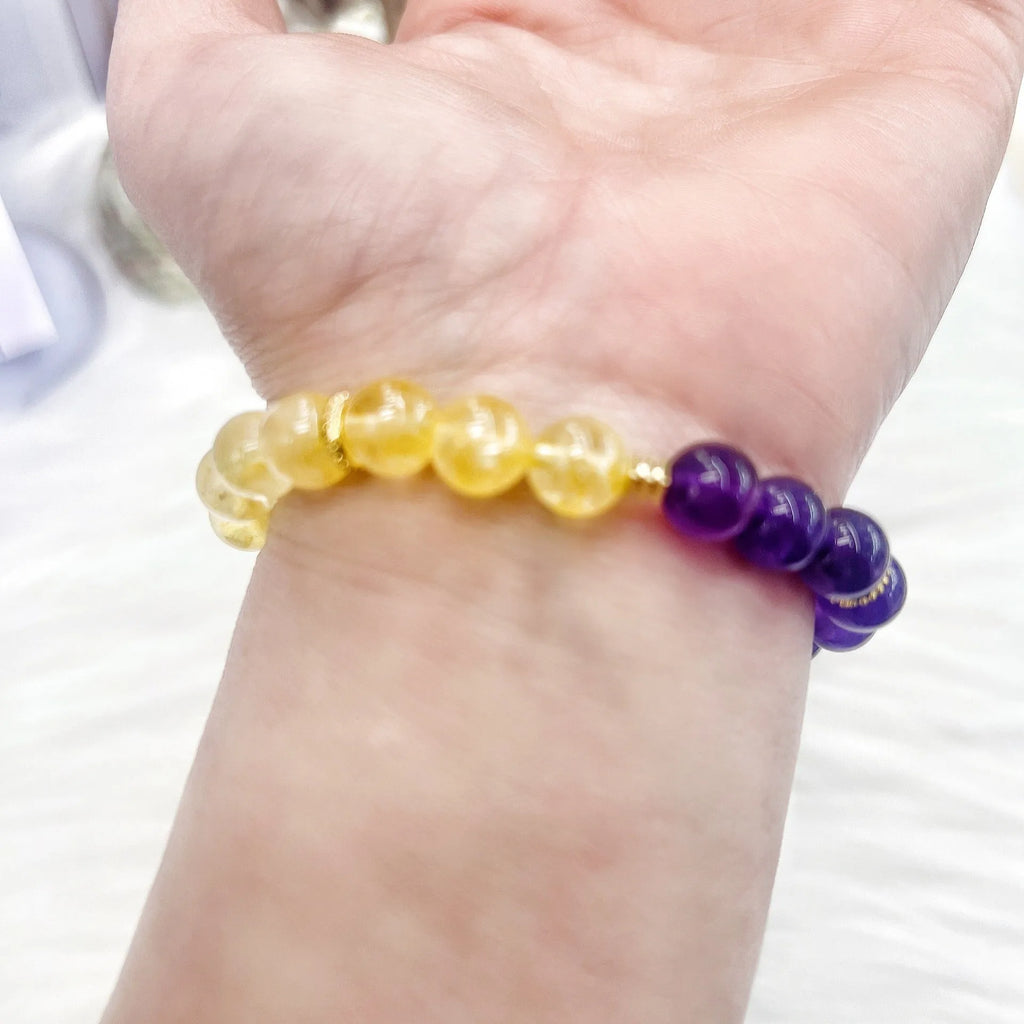 Handmade women's amethyst crystal bracelet with yellow and purple colour tones