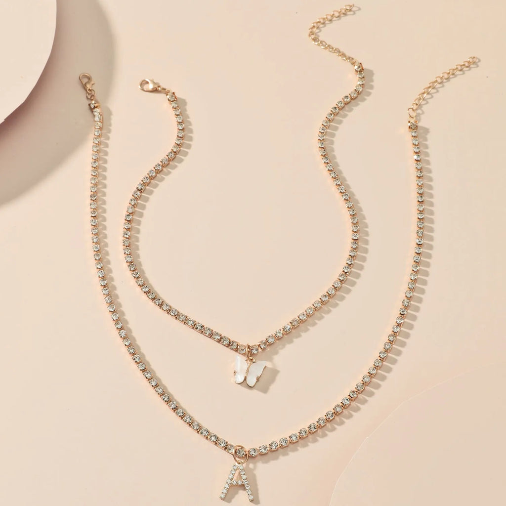 Personalised diamond letter necklace with rhinestone pendant on claw chain in gold finish