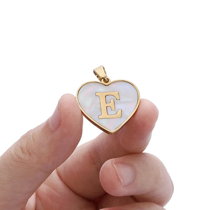 Gold heart necklace with white shell centre on stainless steel chain