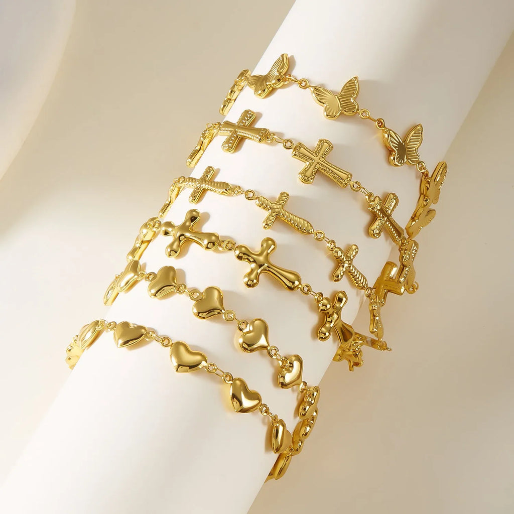 Minimalist stainless steel bracelet with heart-shaped butterfly motif on wrist
