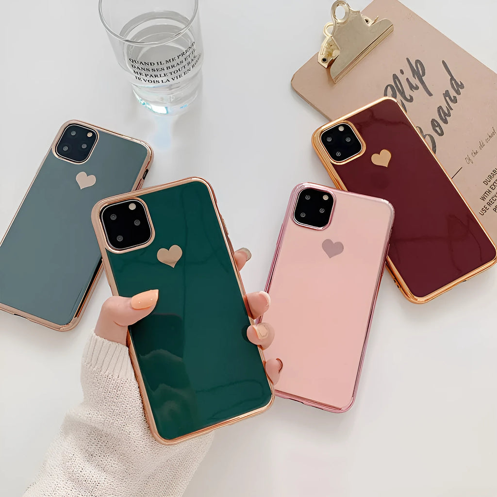 Solid colour blue TPU iPhone back cover case shown next to a claret pink and green version.