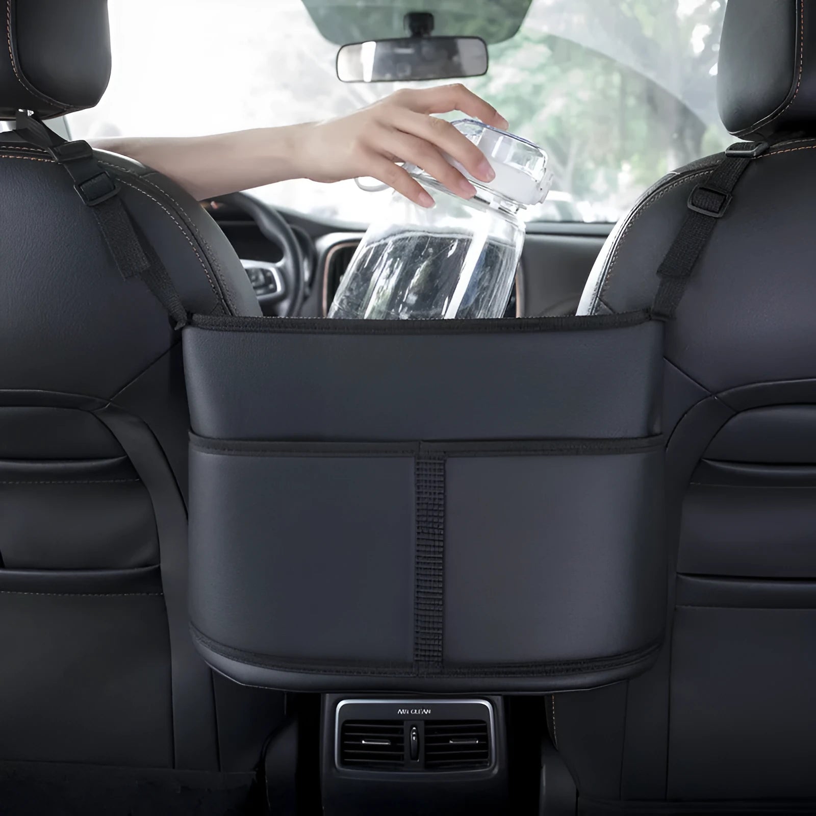 Black leather car seat storage bag with a net pocket, designed for the gap between seats.