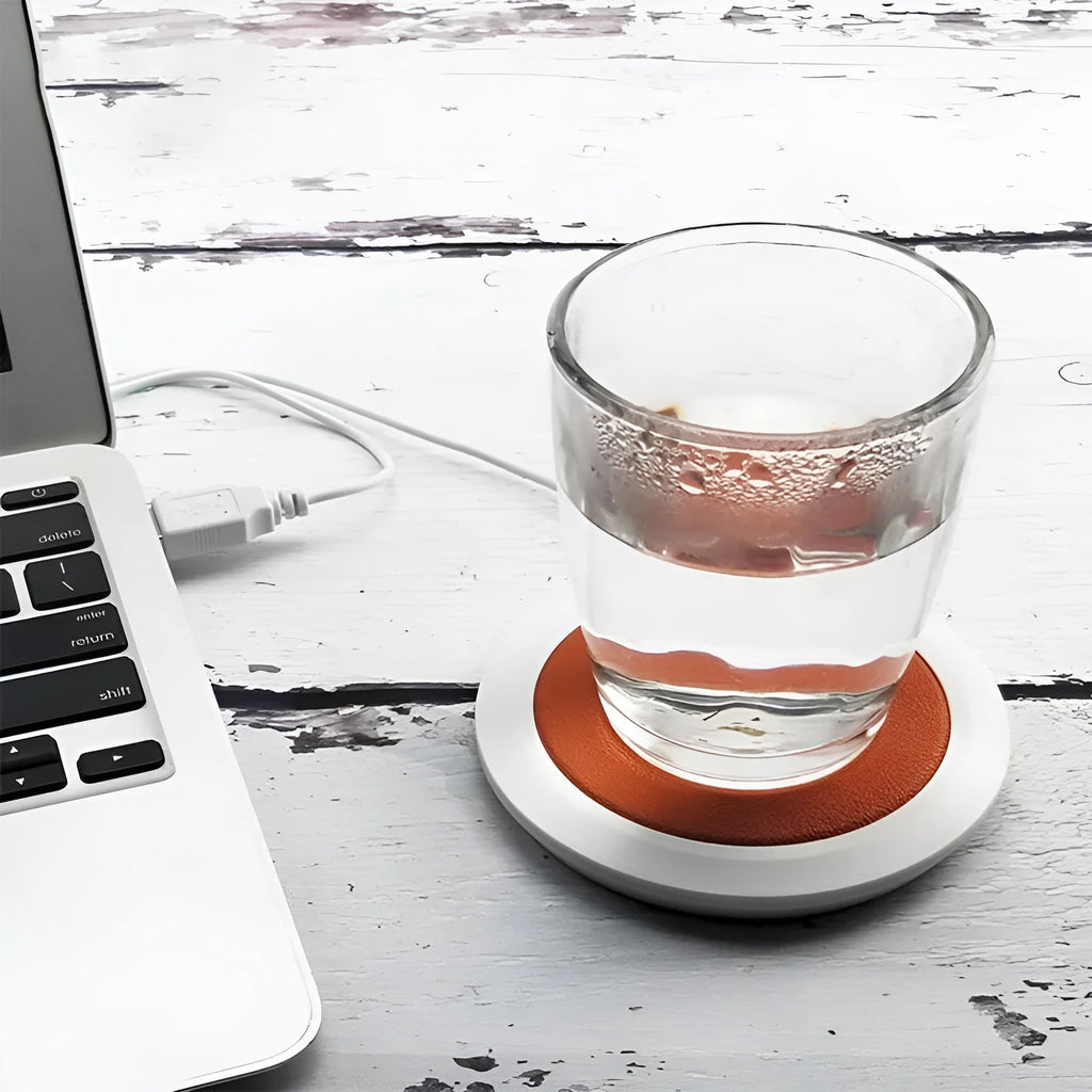 USB heating coaster in PU artificial leather on a desk with a coffee cup, available in black, blue, or orange