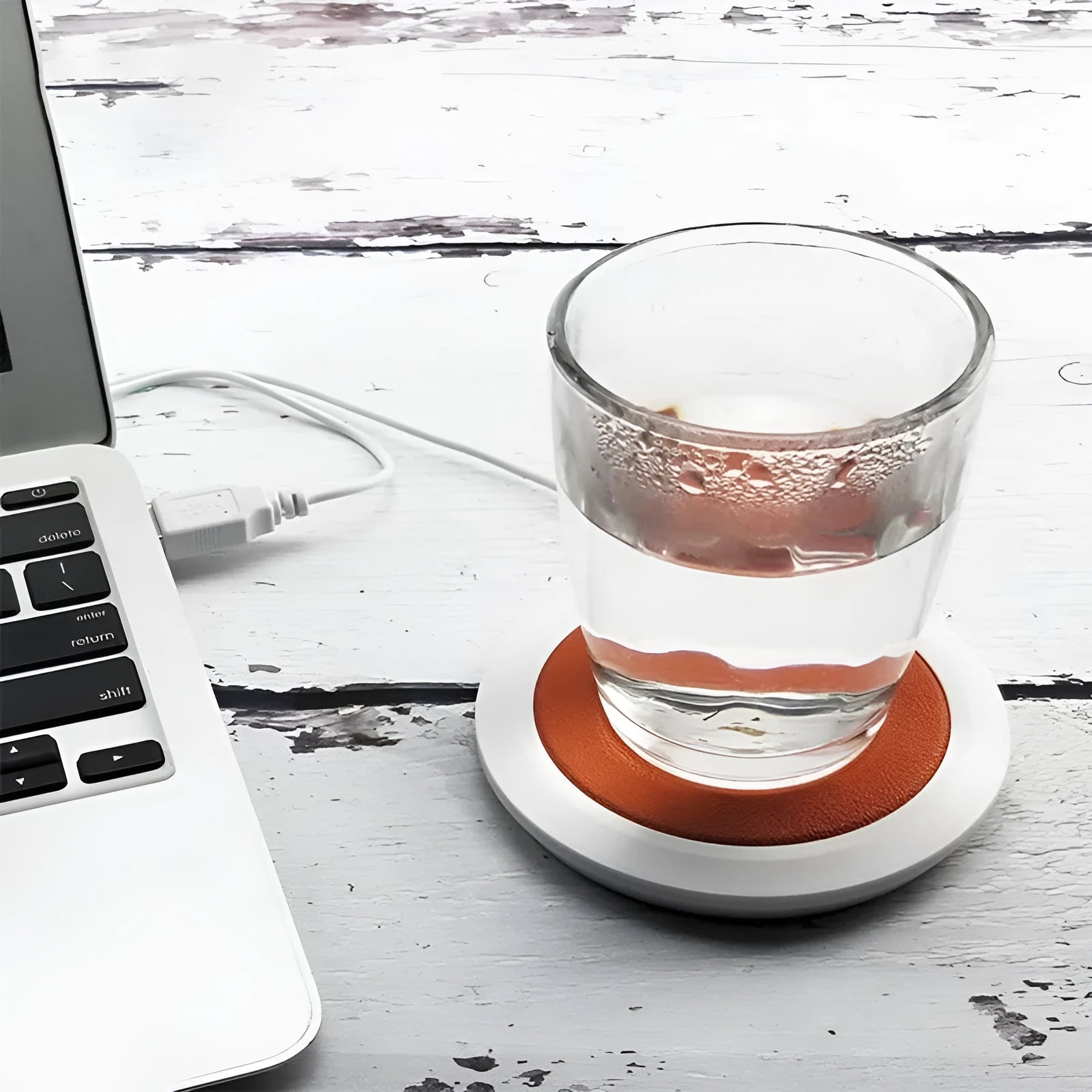 USB heating coaster in PU artificial leather on a desk with a coffee cup, available in black, blue, or orange