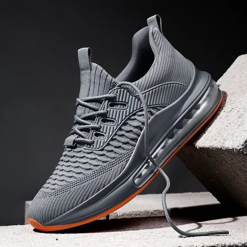 Men's black mesh low-top running shoes with white rubber sole on a plain background.