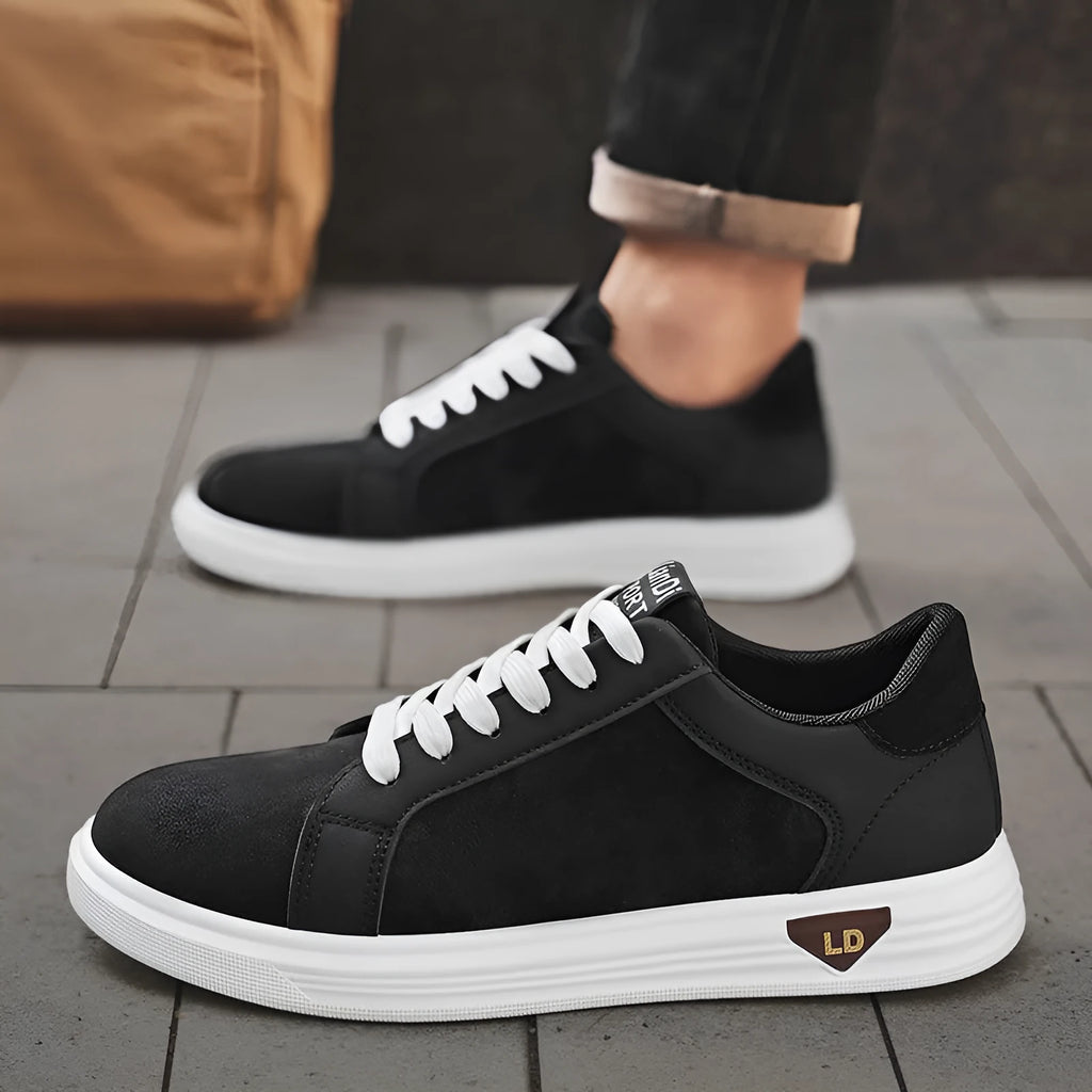 Men's low-top casual sneakers with snake pattern in black, PU upper, round toe, on a neutral background.