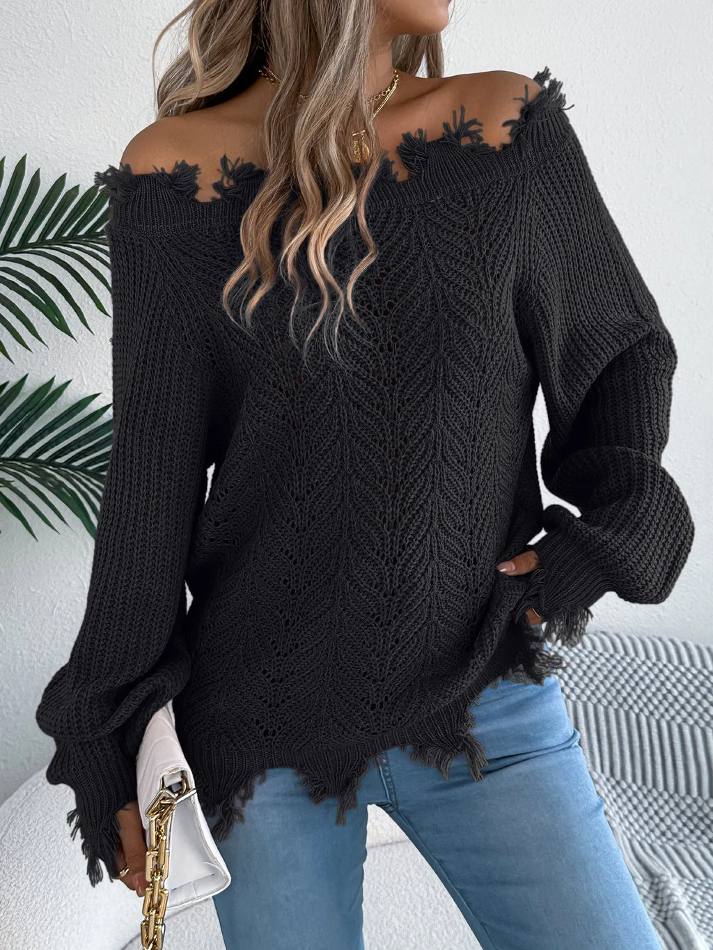 White cut off-the-shoulder pullover sweater with hollow-out long sleeves and street fashion styling
