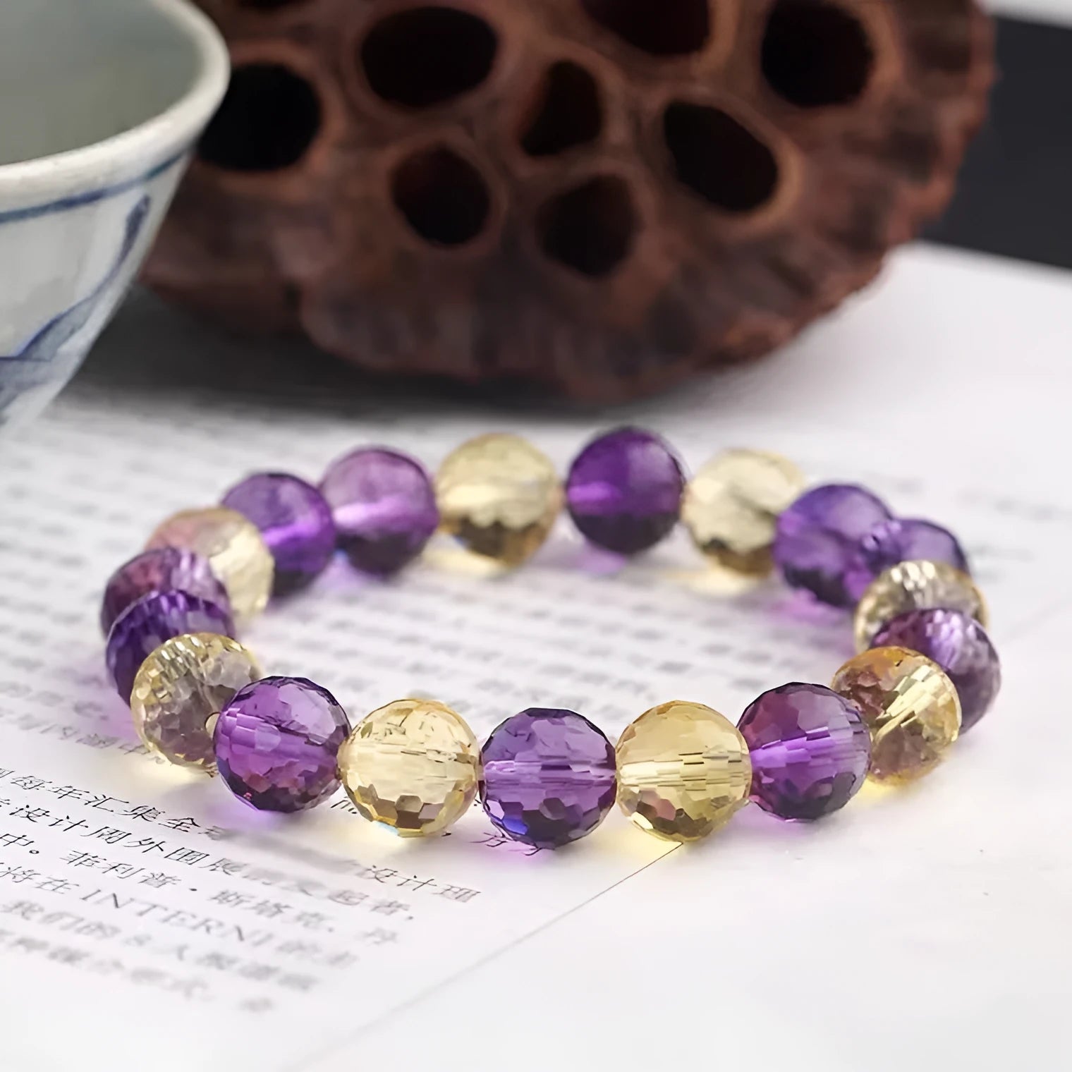 Handcrafted unisex crystal bracelet with 128-facet beads in amethyst, available in multiple bead diameters.