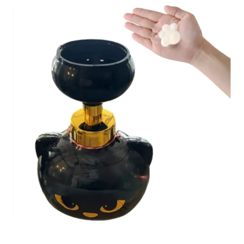 Black plastic cartoon cat shaped manual soap dispenser, 18cm tall.