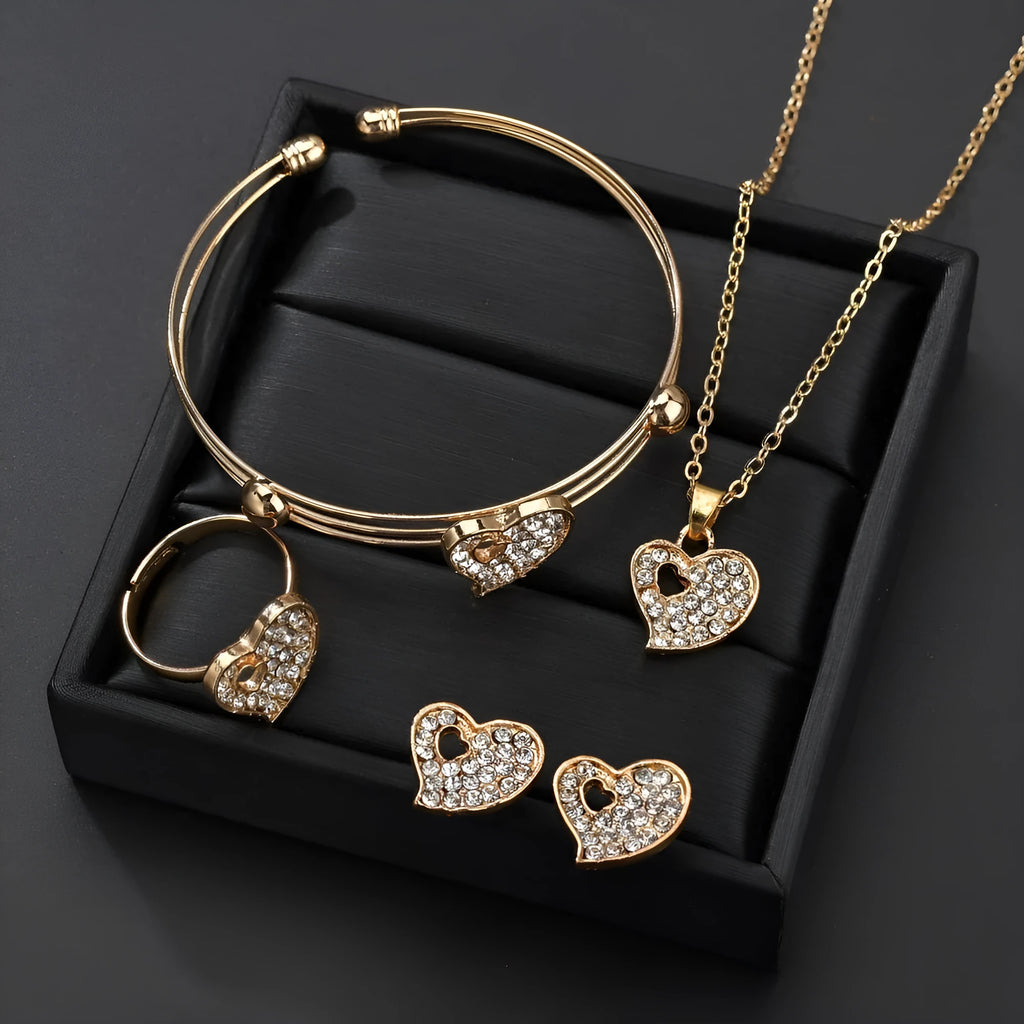 Women's gold alloy jewellery set with earrings, necklace featuring love pendant, and matching bracelet