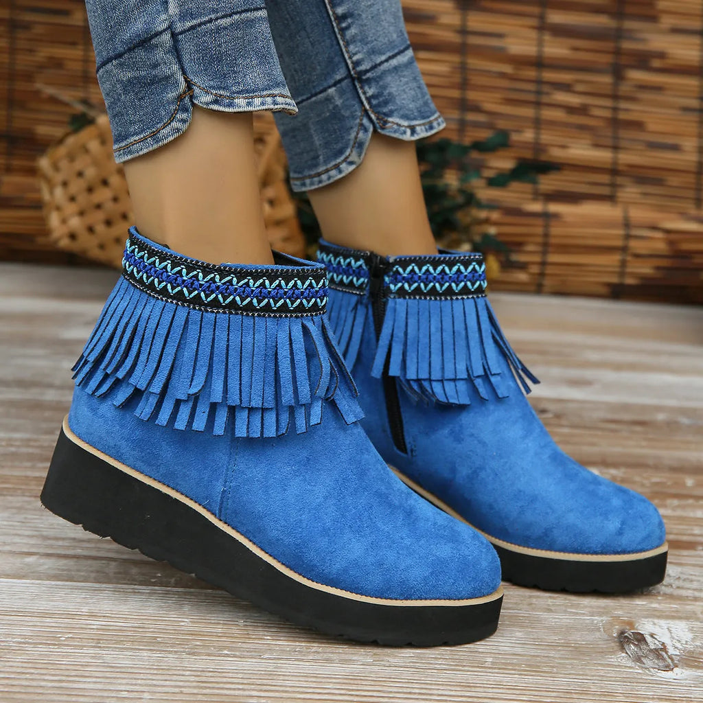 Women's suede wedge ankle boots in dark brown with a side zipper and tassel detail.