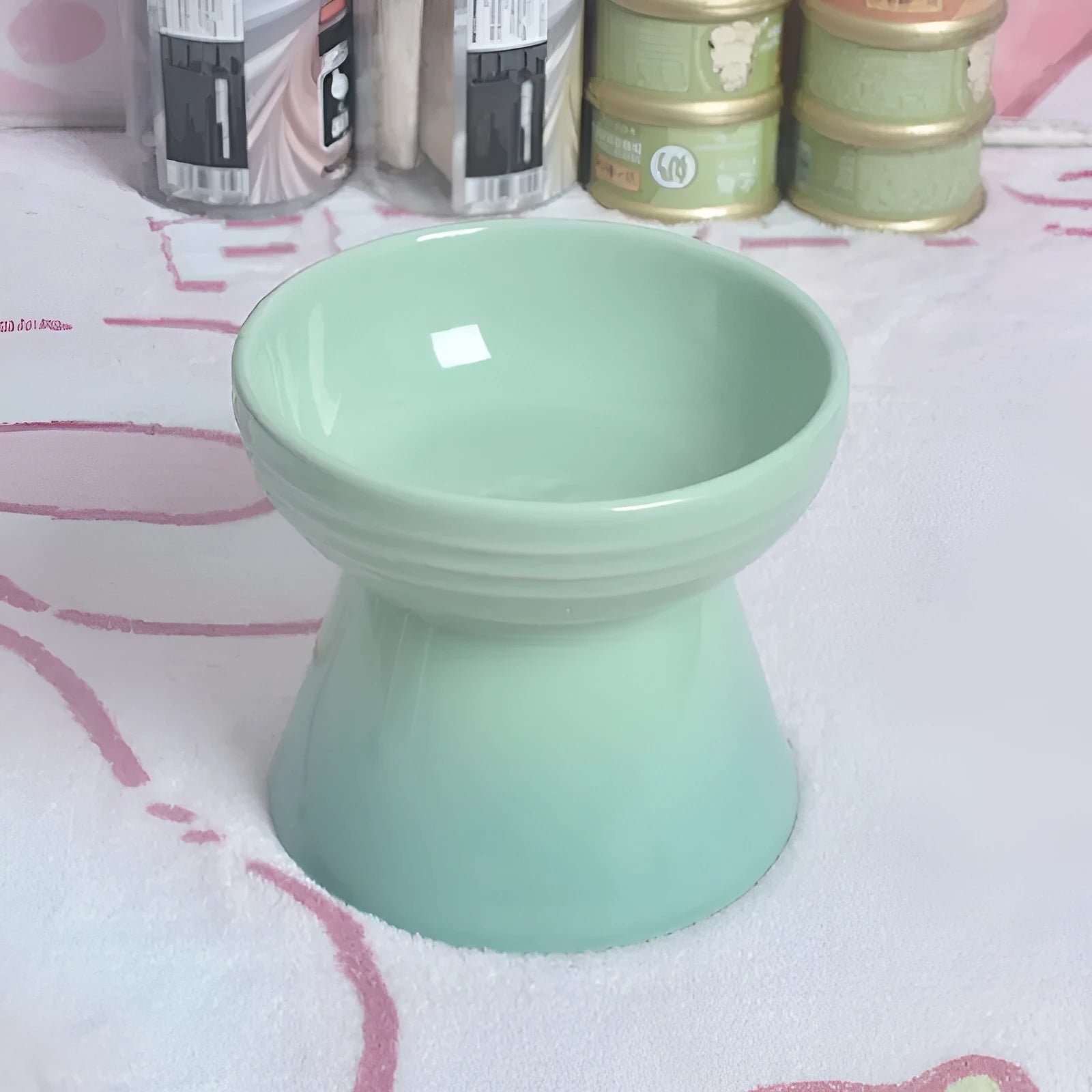 Ceramic anti-tumble pet bowl for dogs and cats with high foot and neck protector.