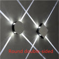 Modern square aluminium and iron LED wall light with warm white glow on a wall