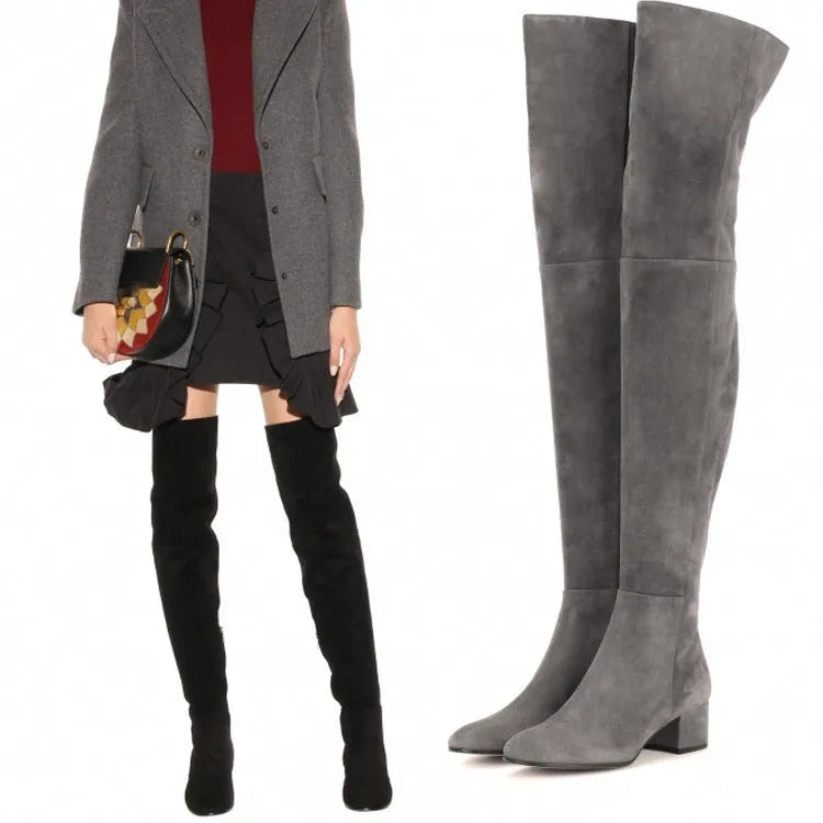 Grey suede women's over-the-knee flat boots with a pointed toe and thick low rubber sole.