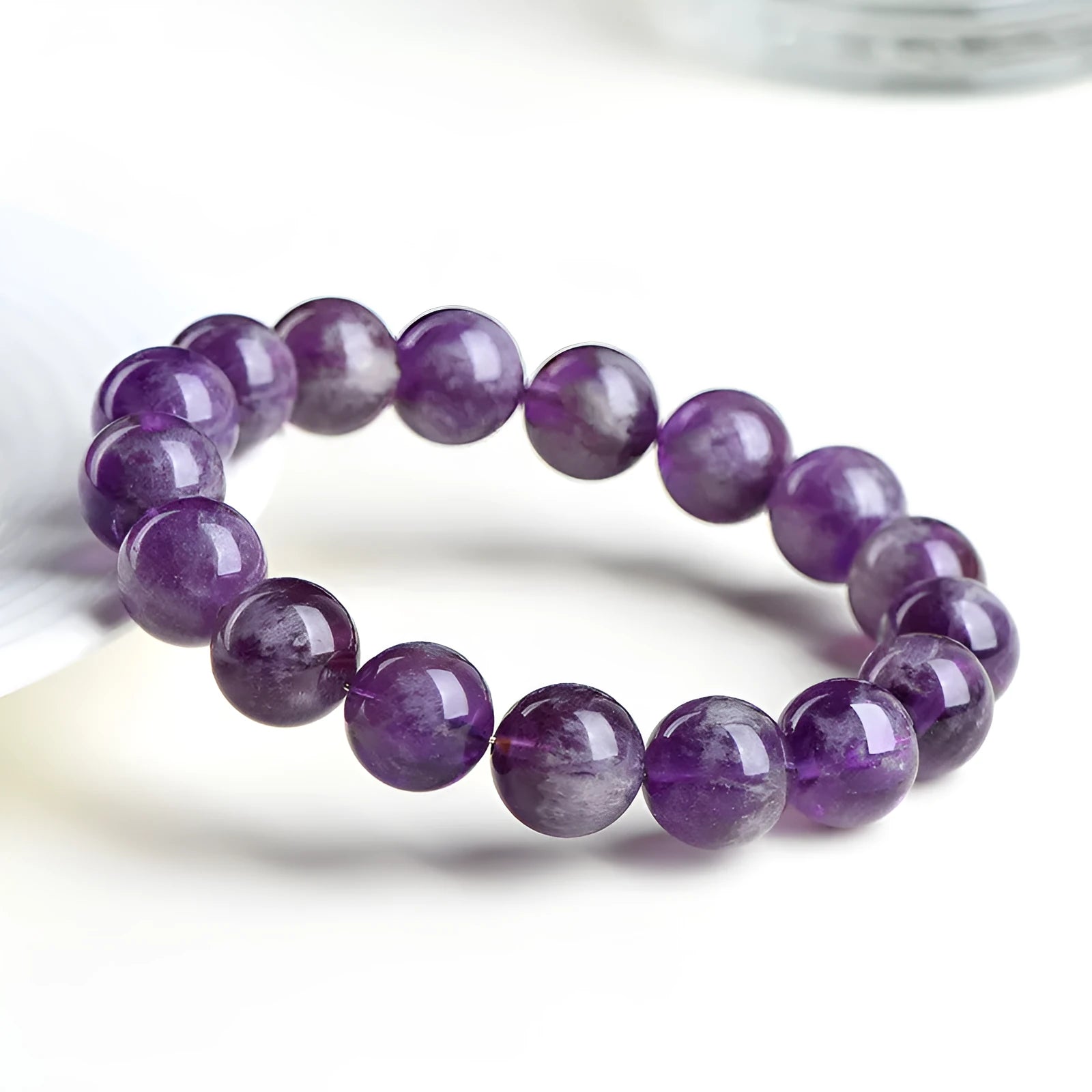 Natural Feather Amethyst bracelet with scattered beads in Snow Mountain purple colour on white background