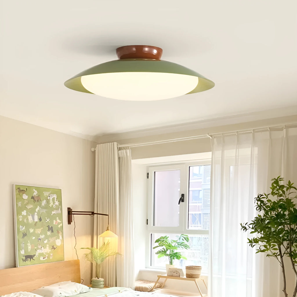 Modern cream-style flying saucer ceiling lamp with an iron shade, shown in a bedroom setting.