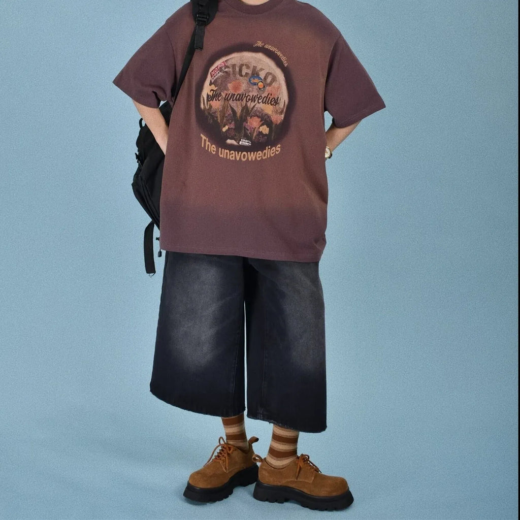 Men's loose-fit straight-leg denim shorts in blue, shown on a hanger.