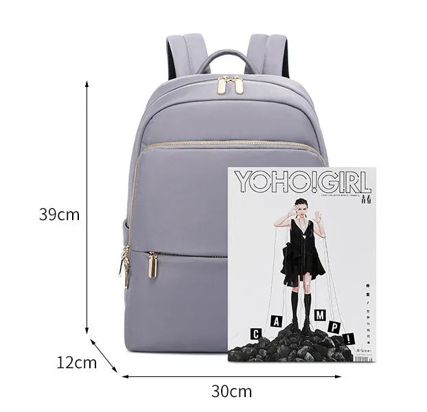 Oxford cloth women's backpack in black and purplish grey with anti-theft features and waterproof construction