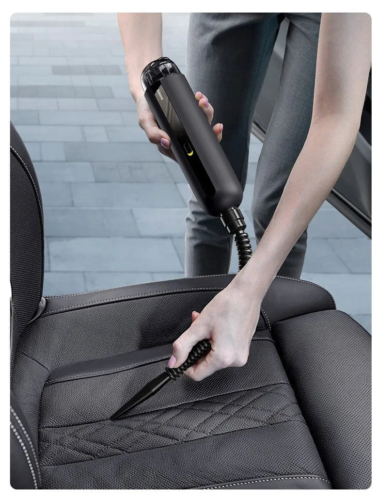 Baseus handheld cordless car vacuum cleaner in black, white, or green with suction and blow functions.