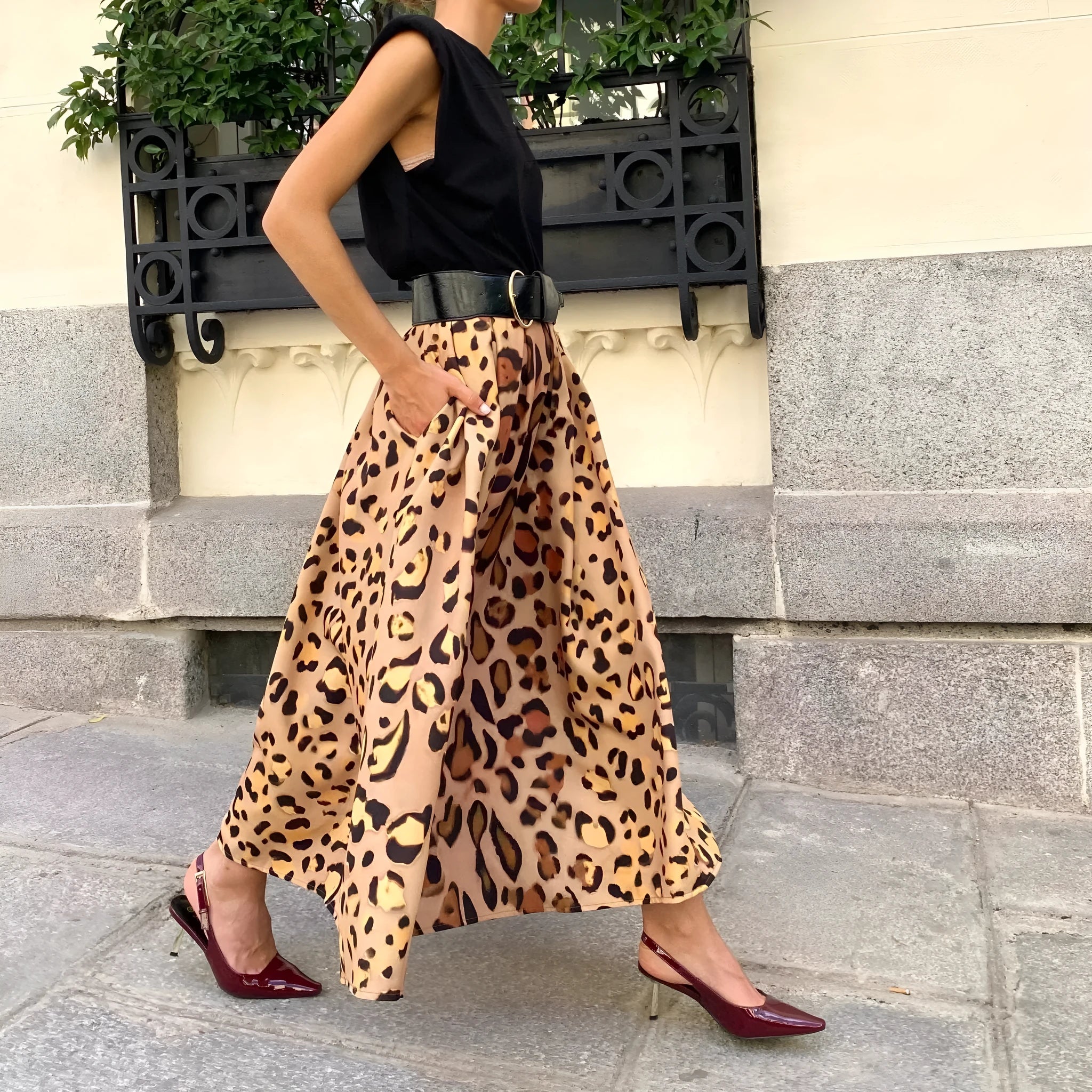 Women's brown leopard print A-line long skirt with big hem design on hanger