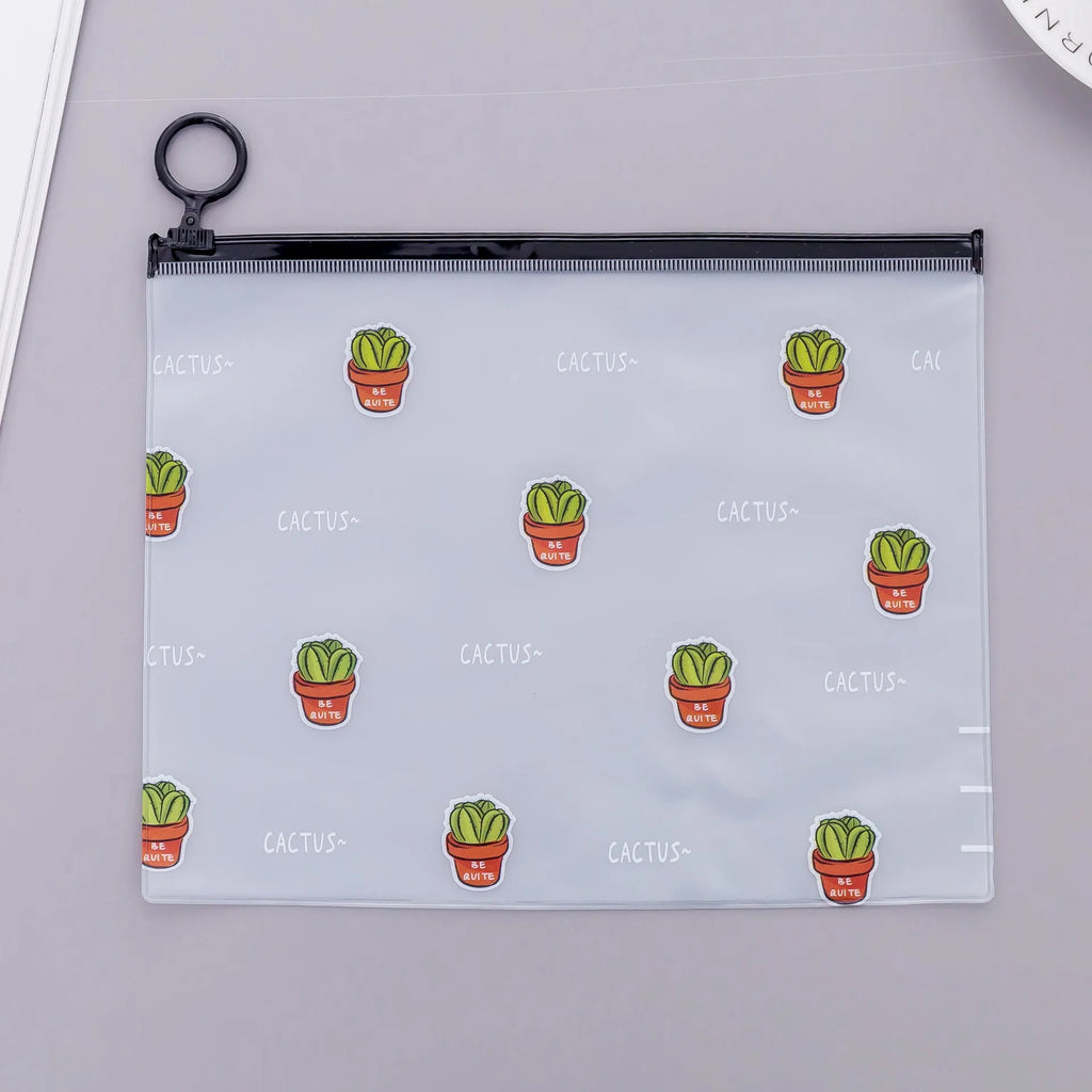 PVC pencil case with sealed closure, cactus print, 17.1x21.2cm, on a desk with stationery