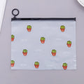 PVC pencil case with sealed closure, cactus print, 17.1x21.2cm, on a desk with stationery