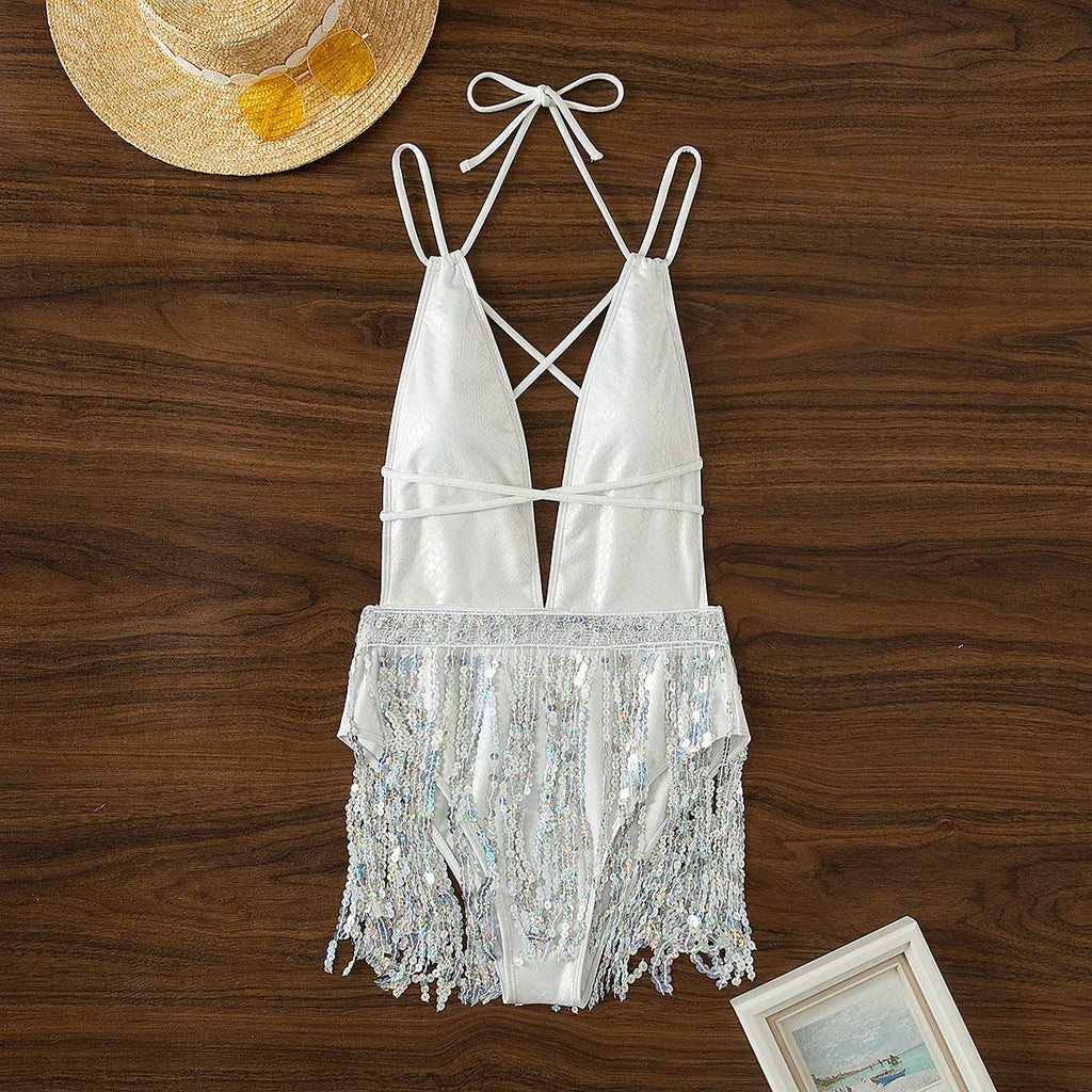 White one-piece swimsuit dress with deep V-neck and tassel decoration