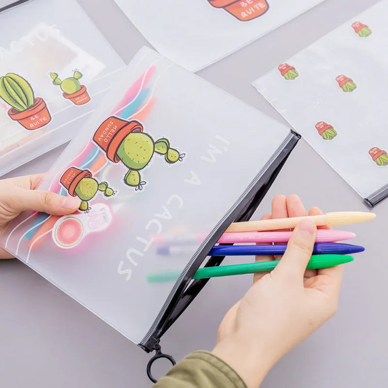 PVC pencil case with sealed closure, cactus print, 17.1x21.2cm, on a desk with stationery