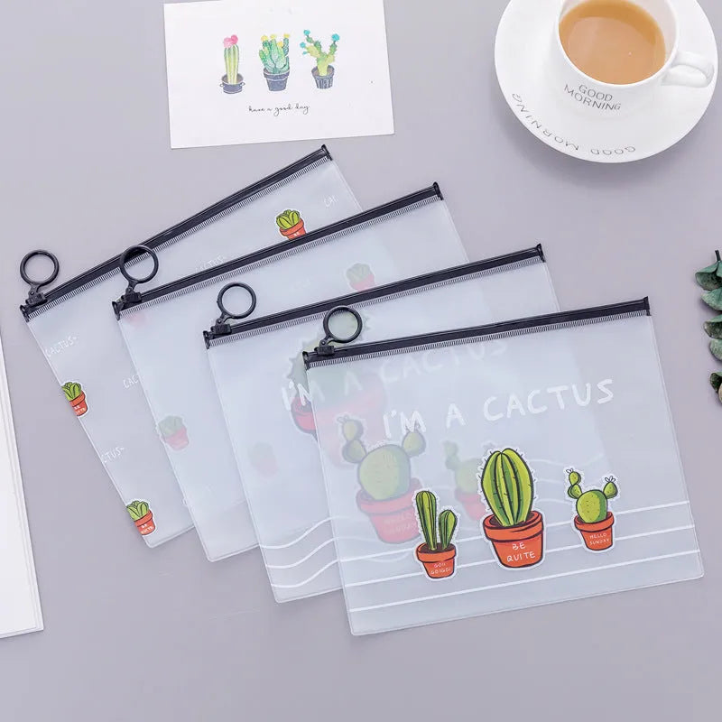 PVC pencil case with sealed closure, cactus print, 17.1x21.2cm, on a desk with stationery