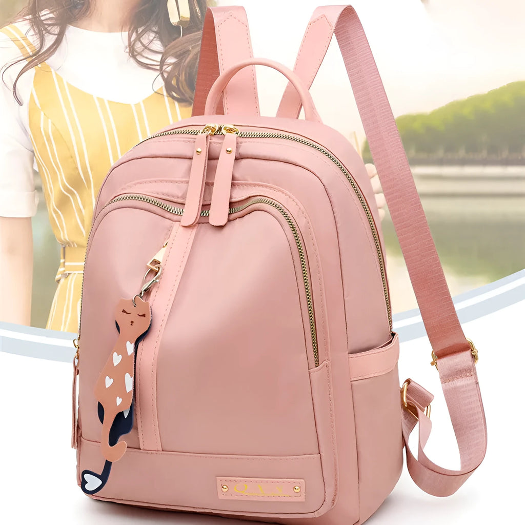 Black women's casual nylon backpack with soft handle and shoulder straps showing internal compartments
