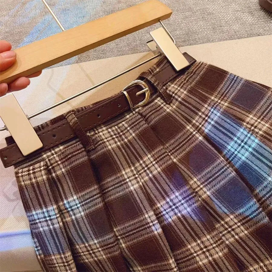 Girls' plaid pleated skirt in cotton blend fabric shown in A-line style for casual wear