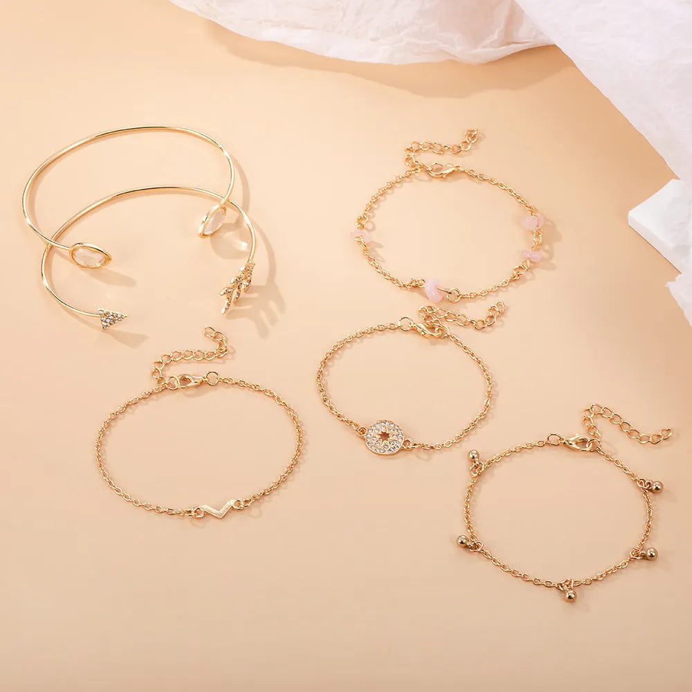 Six-piece zinc alloy women's bracelet set with golden spots, drill arrows, water droplets, and V-shaped links