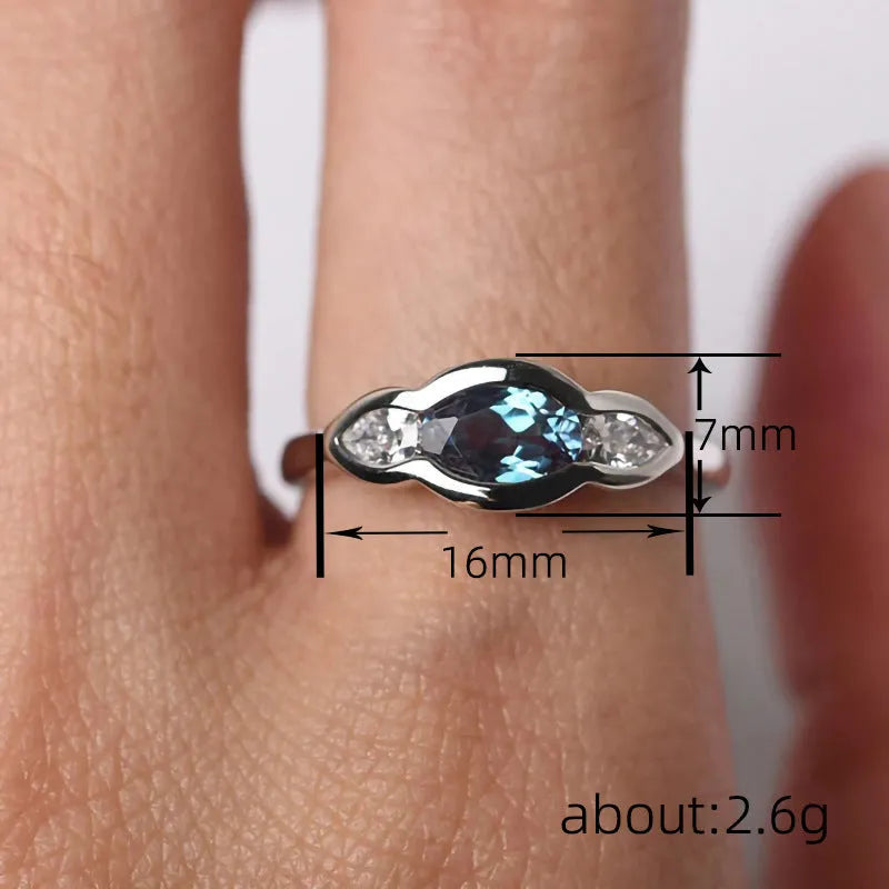 Geometric ellipse women's ring with inlaid zircon stones in Q941 white gold finish on copper