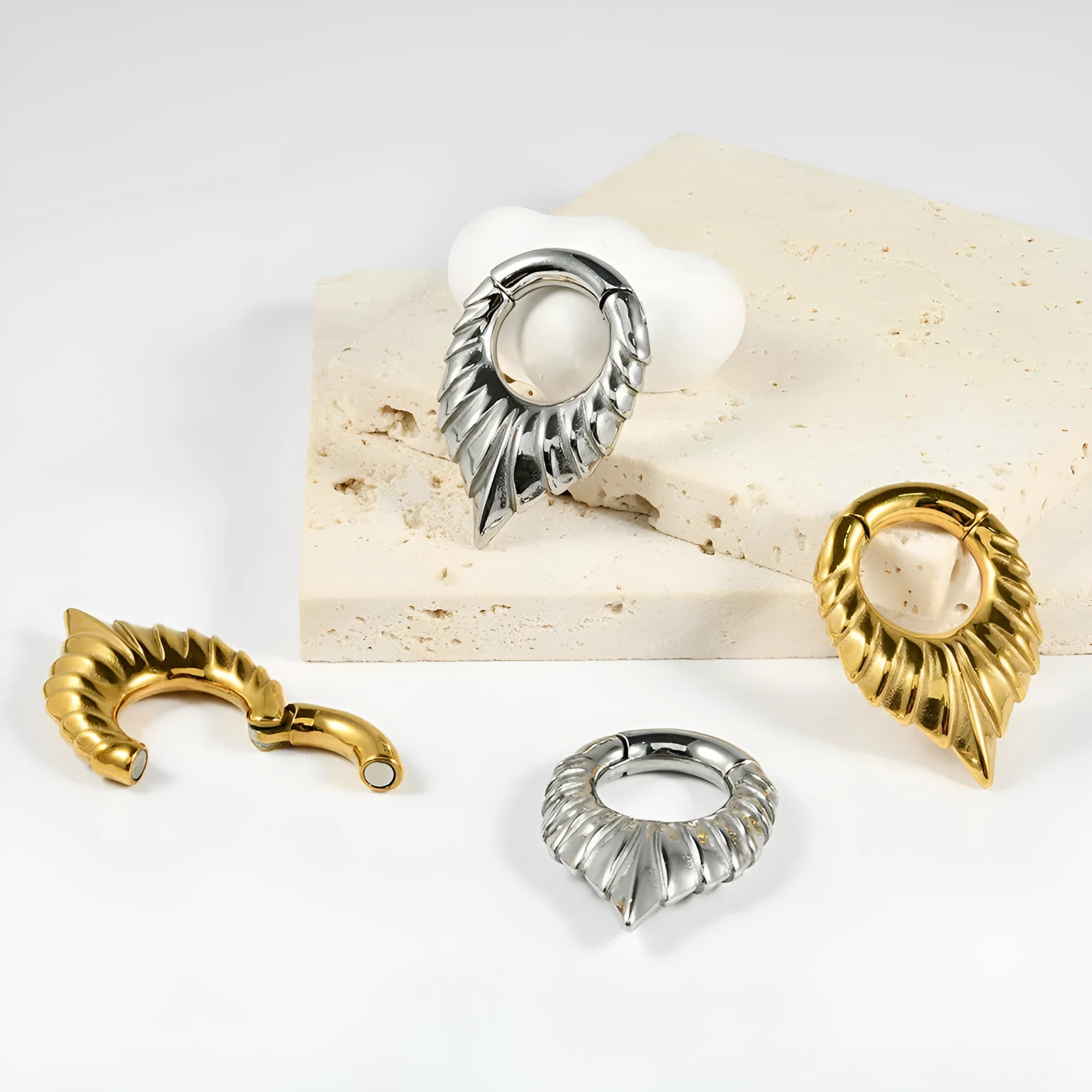 Stainless steel drop-shaped ear extender jewellery with a round hanging egg and totem design.