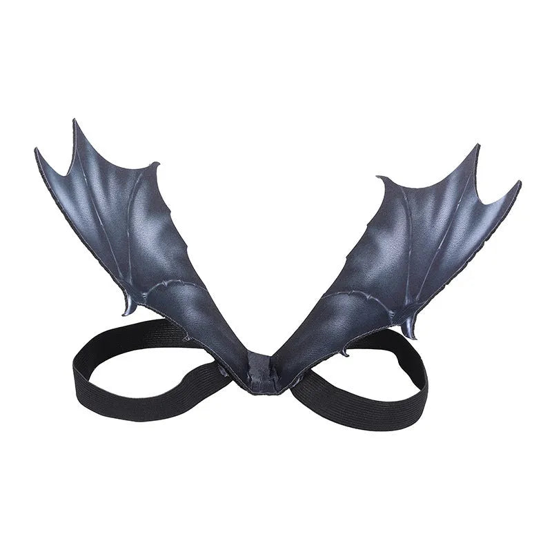 Black cloth bat wing costume for dogs and cats on a Halloween background.