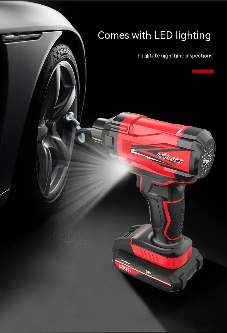 Red and black portable wireless car tyre air pump with power cable and nozzle attachments on a table.