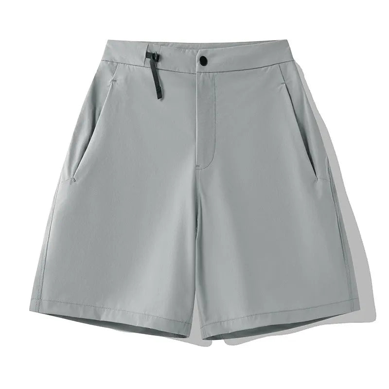 Men's quick-drying sports shorts in khaki colour with elastic waistband.