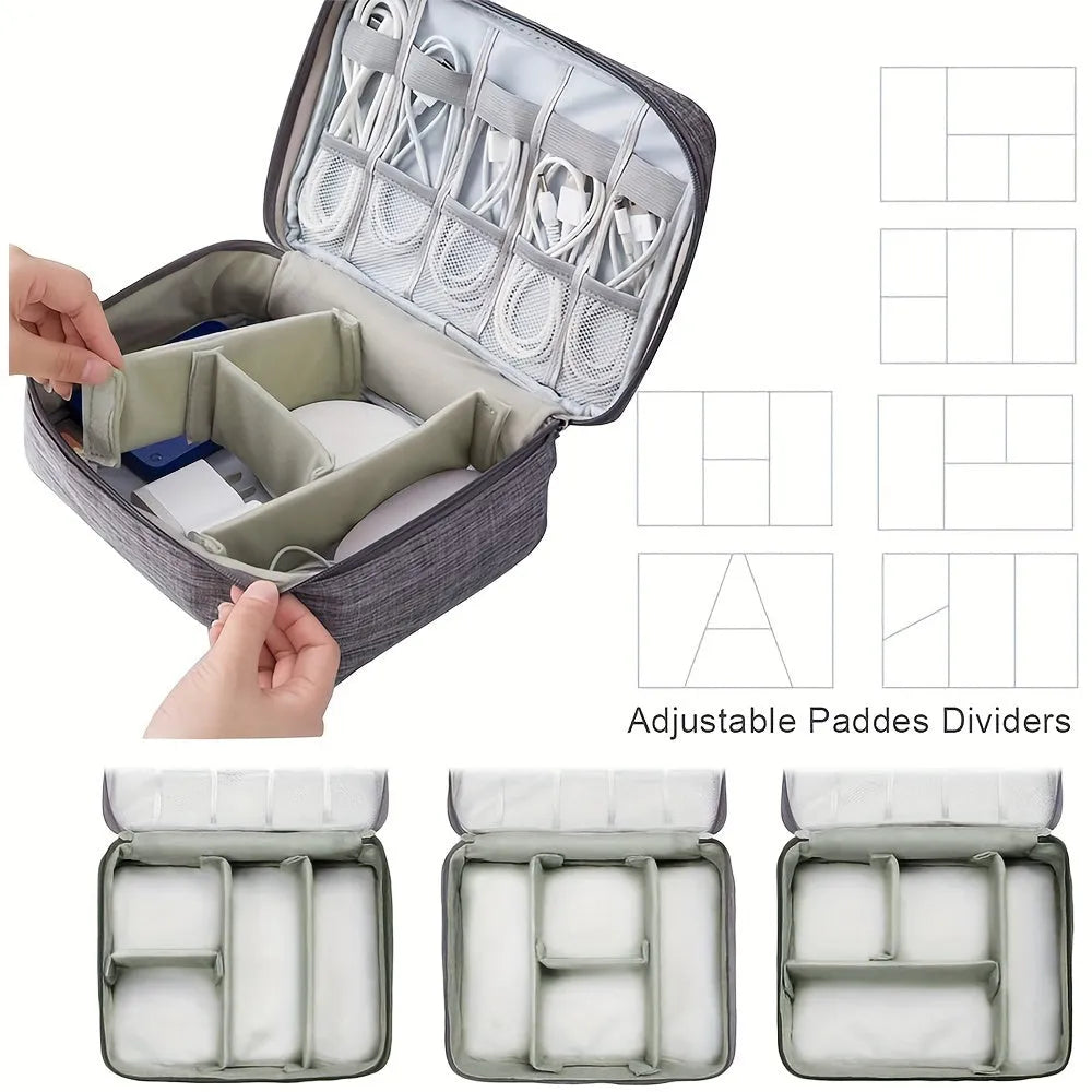 Black electronics organiser case open showing mesh pockets, elastic loops, and removable padded dividers for cable organisation