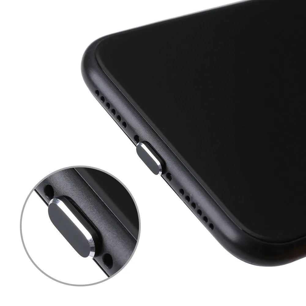 Aluminium alloy iPhone charging port dust plug in rose gold colour next to an iPhone.