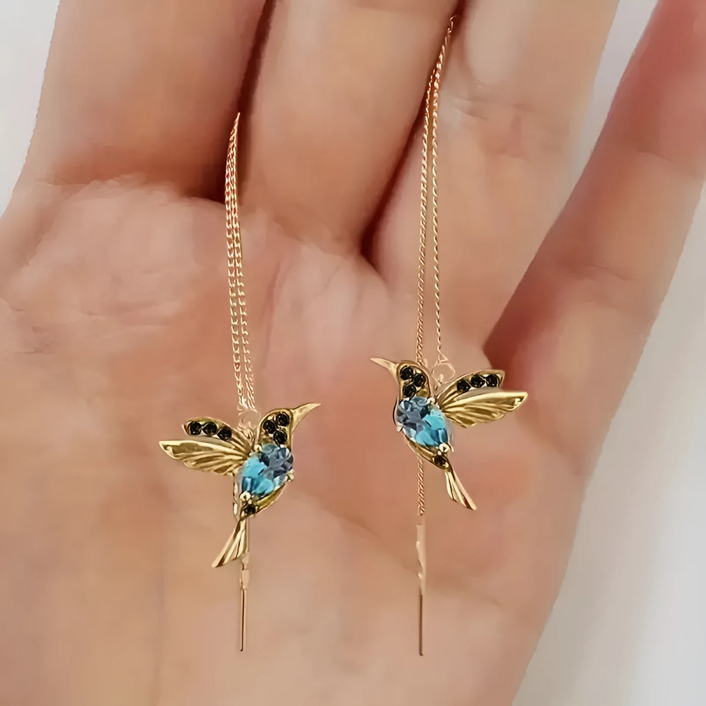 Long style women's earrings with a hanging bird design featuring mixed zirconium wings.