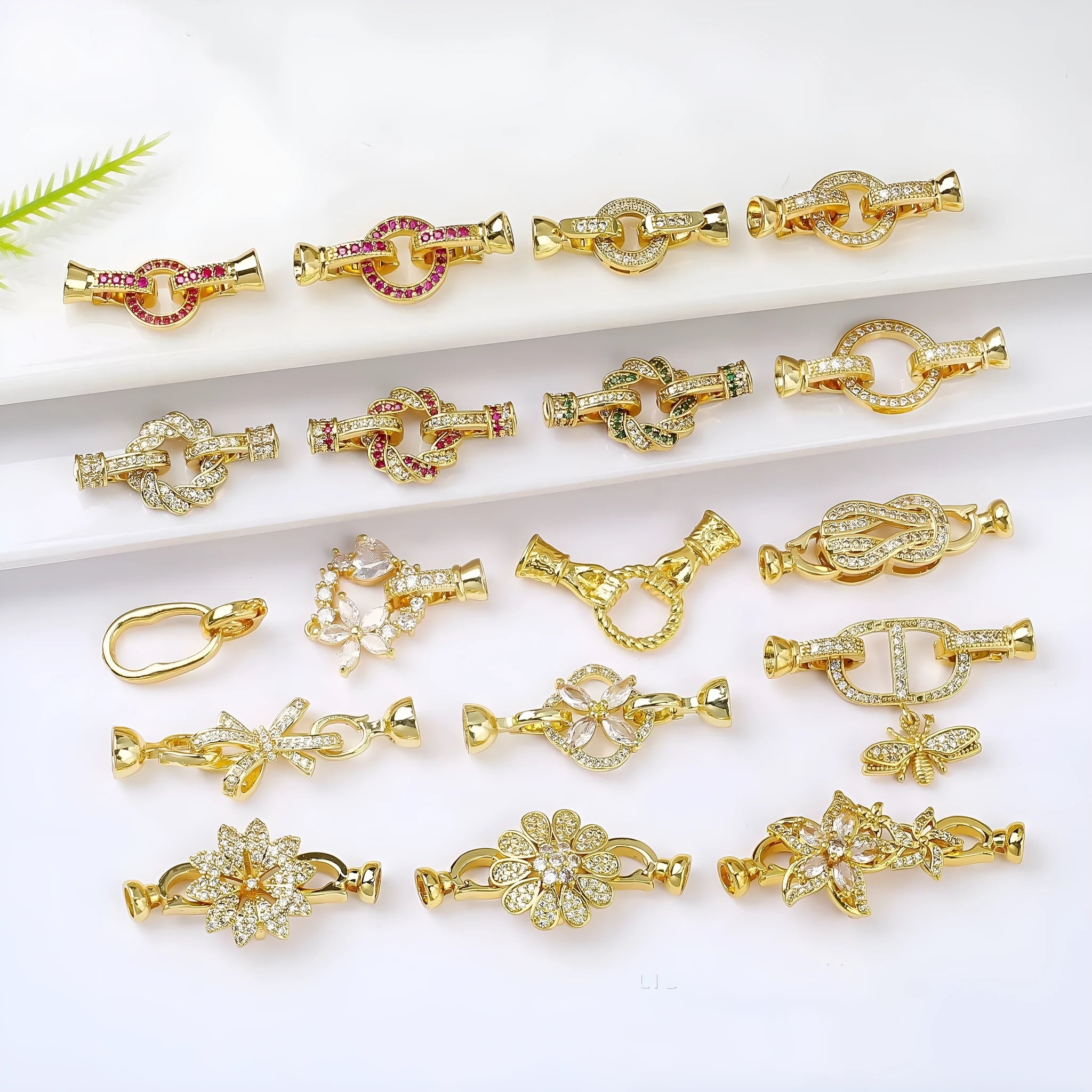 Small gold-coloured jewellery clasp and end hook for DIY necklace or bracelet making and repair.