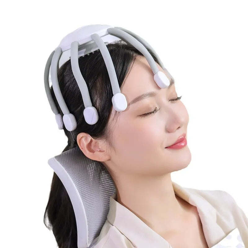 Black or white electric head massager with multiple plastic claws for scalp vibration and relaxation.