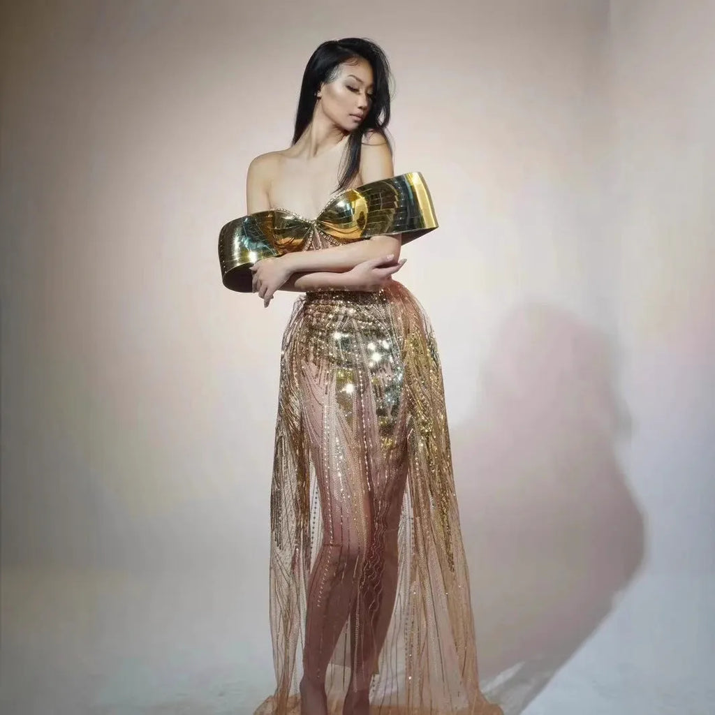 Gold strapless sequined long dress with tulle skirt and side slit detail.