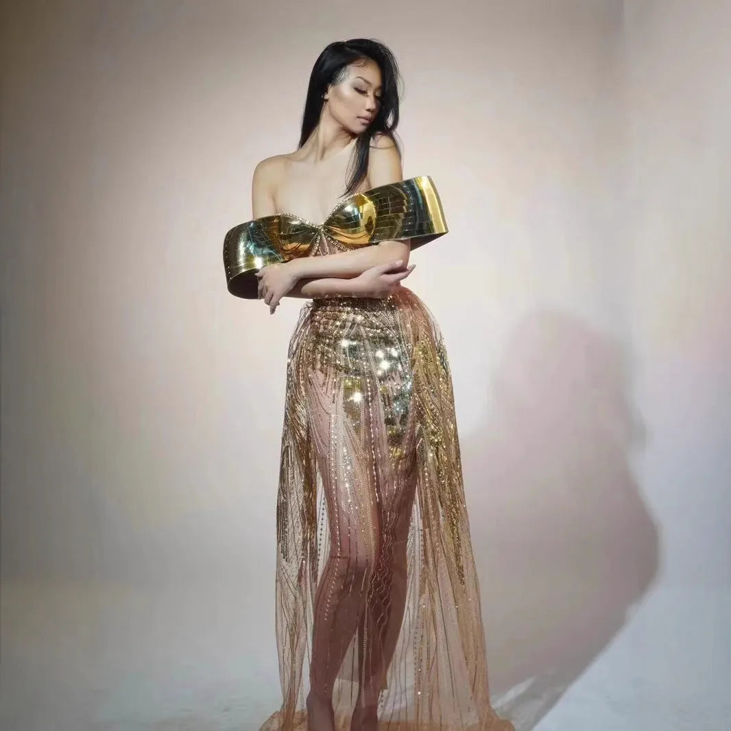 Gold strapless sequined long dress with tulle skirt and side slit detail.