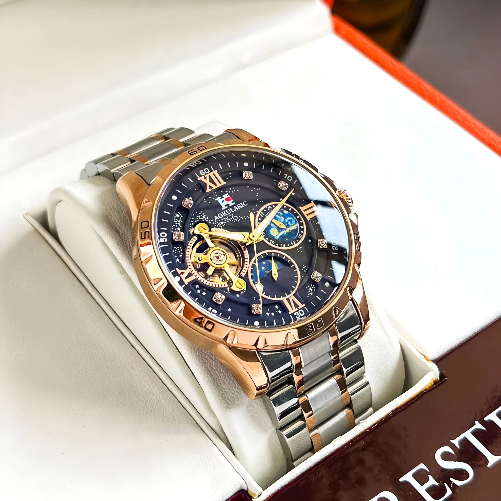 Men's rose gold automatic mechanical watch with black dial and 12mm thick case.